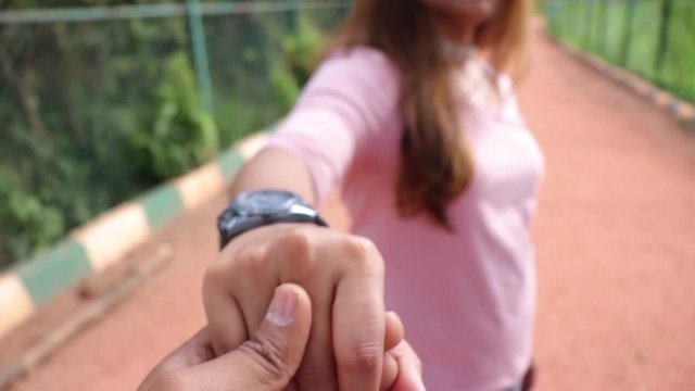 POV shot lifting up a hand of beautiful Indian woman.