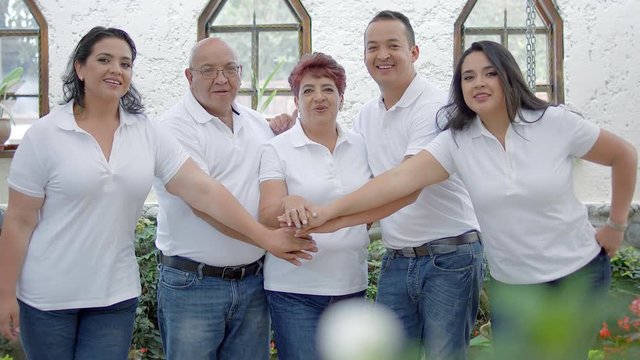 Hispanic family team wearing white at home