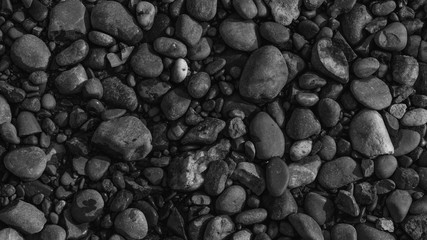 gravel with water texture natural abstract dark black and white background close-up