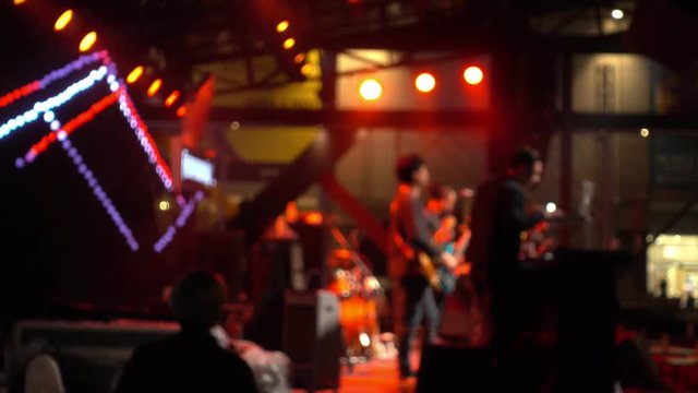 Live music brand showing on stage, short in defocus, creating a beautiful bokeh