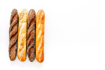 Fresh rustic homemade bread on white background top view space for text