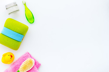 Children's personal care kit. Bath accessories with teeth brush on white background top view copy space