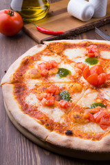 Two different pizzas freshly baked