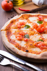 Two different pizzas freshly baked