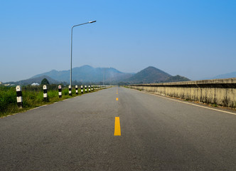 Fototapeta na wymiar Blank road with mountain background