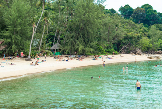 Tourists sunbathing and swimming in the sea at Koh Raham , Surat Thani in Thailand. March 31, 2018.