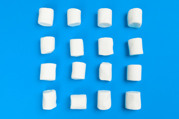 Marshmallows on blue background