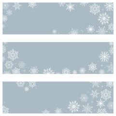 Vector banners snowflakes. On a blue background white snowflakes. Winter ornament.