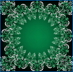 green and white curled frame ornament on dark background
