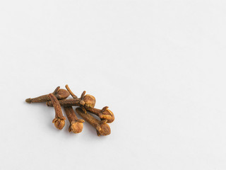 A group of cloves on a white background. copyspace