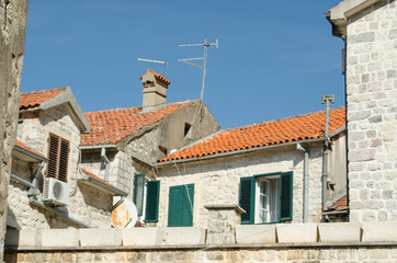 Red tiled roofs on the old houses of the old town in Montenegro.