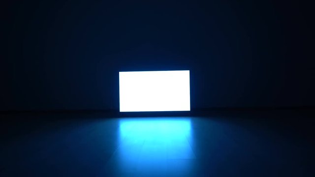 The television with white screen in the dark room