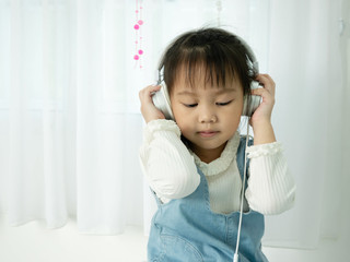 children relaxed and concentrated, listening to music .