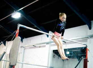 Foto op Plexiglas Young gymnast on a horizontal bar © Rawpixel.com