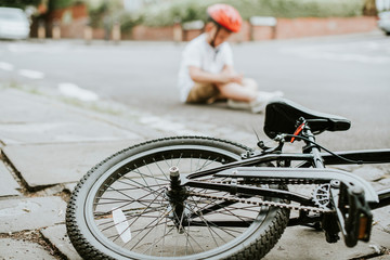 Young boy knocked off his bike