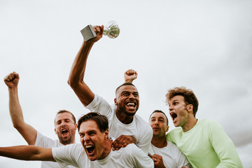 Soccer players team celebrating their victory - Powered by Adobe