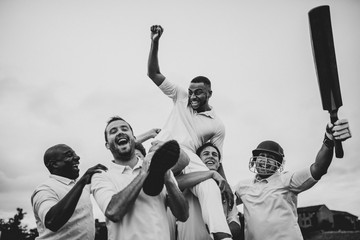 Cheerful cricketers celebrating their victory