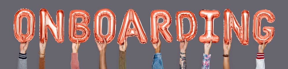 Hands holding onboarding word in balloon letters