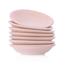 Simple clay plate on white background. Traditional craft.