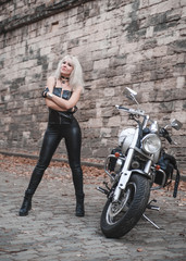 Beautiful biker woman with motorcycle.
