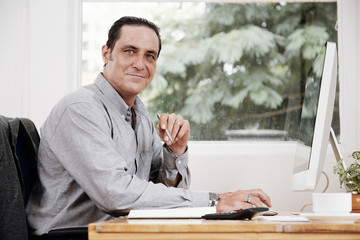 Mature entrepreneur busy with work