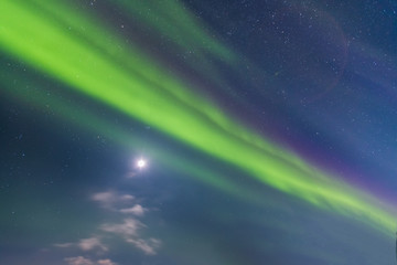 Beautiful green northern lights and the Moon