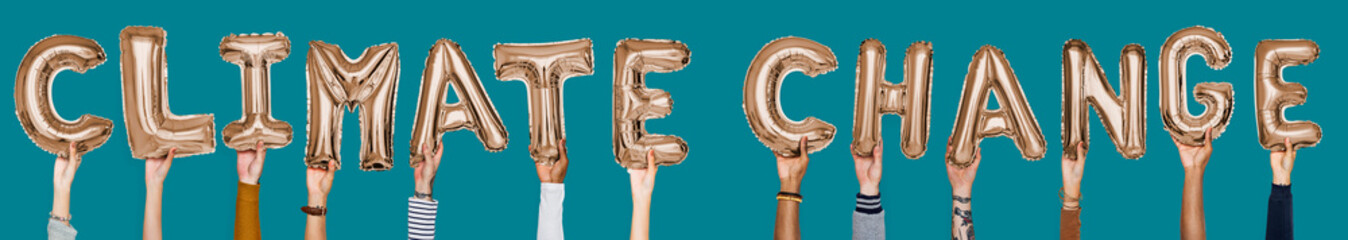Hands showing climate change balloons word