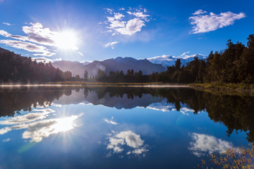 he Reflection on Lake Matheson in Fox Glacier, West Coast, New Zealand at sunrise