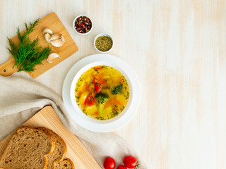 Healthy bright spring vegetable dietary vegetarian soup with broccoli, top view, copy space