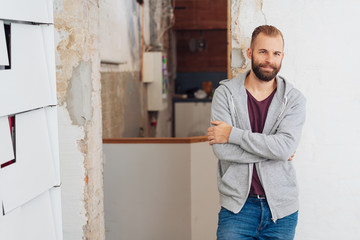 casual trendy bearded man staring at camera