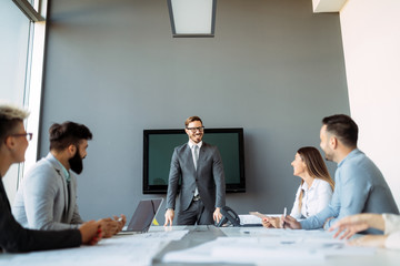Group of architects and business people working together and brainstorming