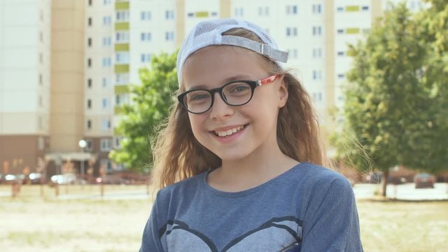 Portrait of a 13 year old teen girl on the street.