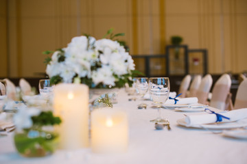 Table setting at a luxury wedding reception.