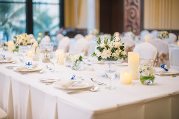 Table setting at a luxury wedding reception.