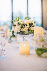 Fototapeta na wymiar Table setting at a luxury wedding reception.
