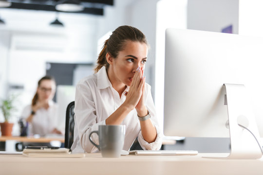 Young business woman work in the office with computer.