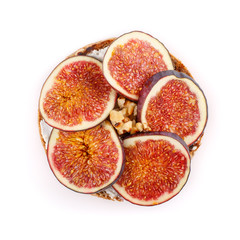 Whole grain bread sandwich with figs and walnuts isolated on white background.