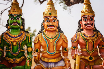 Indian hinduistic sculptures close to holy temple at the countryside of Tamil Nadu