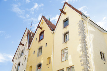 Fototapeta na wymiar Medieval houses, called Three Sisters, on Pikk street in Tallinn, Estonia