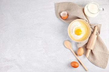 Obraz na płótnie Canvas Ingredients and kitchen utensils for dough preparation