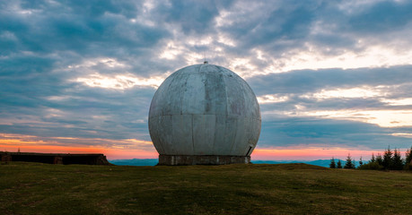 The old military facility is a tracking system. Radar base. Old giant dome of a radar antenna of a...