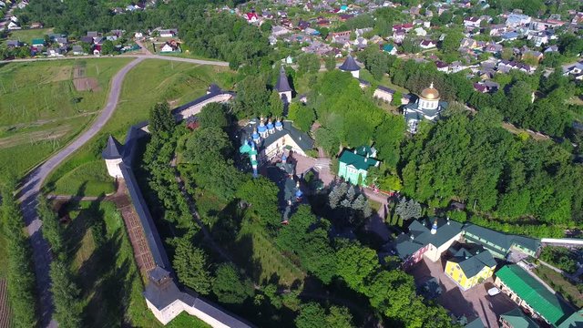Over the Svyato-Uspensky Pskovo-Pechersky monastery on a Sunny June morning (aerial video). Pechora, Russia