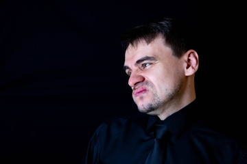 white man black background funny face