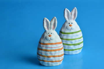 ceramic easter bunny on blue background