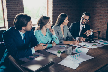 Profile side view of four nice-looking rich serious minded styli