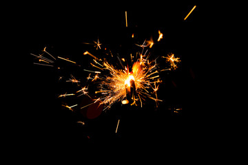 Fototapeta premium Festive Christmas sparklers on dark background
