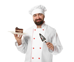 Male chef with tasty dessert on white background