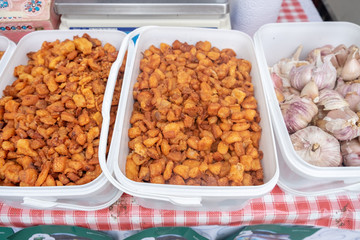 Pork snack or scratching, pork crackling on sale at street market in Rijeka