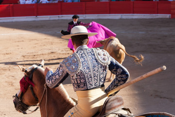 Bullfight, Spanish deadly Spectacle where a man (torero) risks his life fighting again an angry Bull with dangerous horns. This tradition is still strong and alive in Spain. 