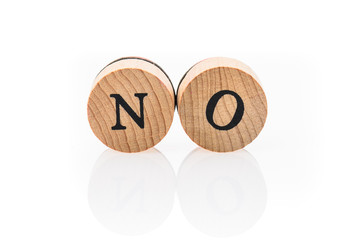 Word No from circular wooden tiles with letters children toy.
